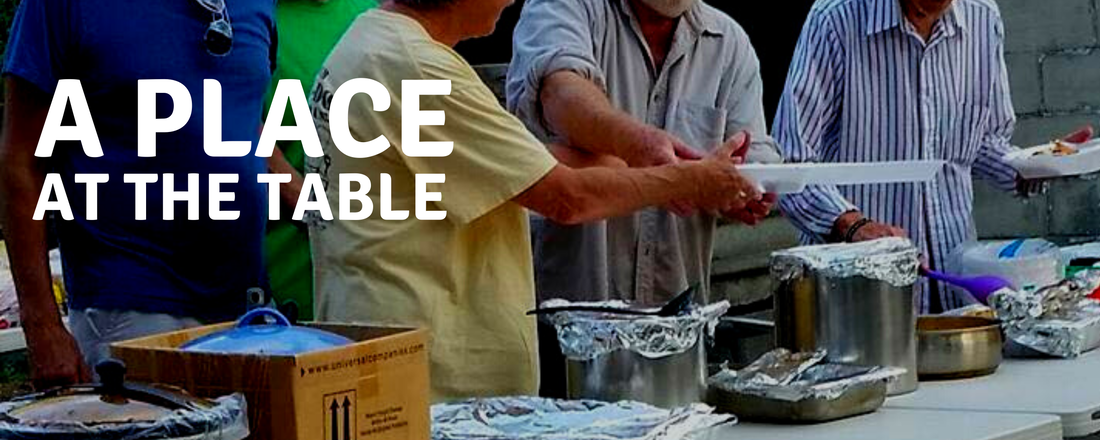 A place at the table. a picture of people creating plates of food for a nonprofit